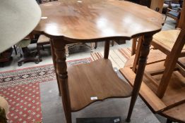A late Victorian mahogany and inlaid table having shaped top