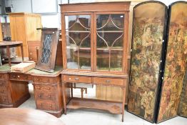 An Edwardian mahogany display cabinet on stand having glazed top with velvet lined shelves, two