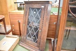 A traditional dark oak corner wall display