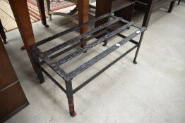 A large cast footman/trivet, width approx. 72cm