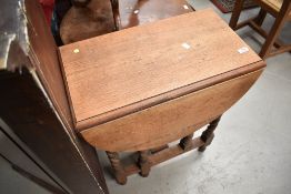 An early 20th Century oak twist gateleg occasional table