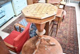 A 19th Century mahogany and inlaid sewing table having 'chequer board' octagonal top, fitted