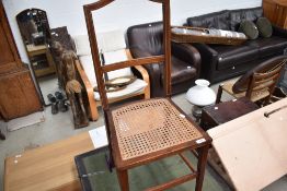 An Edwardian mahogany bedroom chair