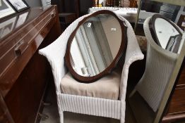 A Lloyd Loom tub chair