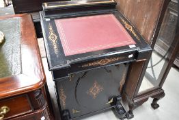 A Victorian ebonised and satinwood davenport, of traditional design with inlaid and ormalu mounted