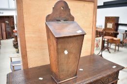 A 19th Century mahogany candle box, with candles (more than four!)