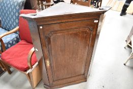 A 19th Century oak corner cupboard