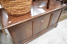 A 1940's oak three panel blanket box, with machined decorative band to facia