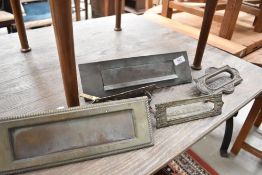 A small selection of brass letterboxes