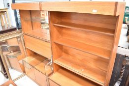 A pair of mid Century teak wall units