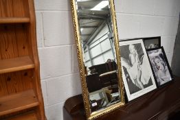 A gilt frame wall mirror