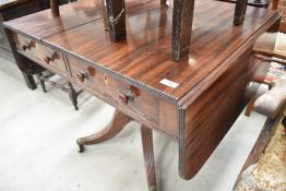 A 19th Century pedestal Pembroke table , in a Regency style , having drawer and dummy to each