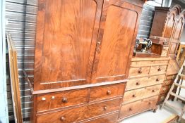 A 19th Century flame mahogany linen press having two over two drawer base, width approx. 140cm