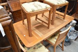 An Art Deco light oak draw-our dining table and six chairs, in the manner of Heals (unmarked)