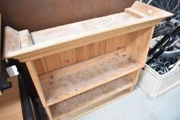 A natural pine wall shelf/plate rack
