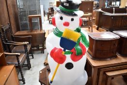 A novelty garden snowman (previously illuminated electrics have been removed)