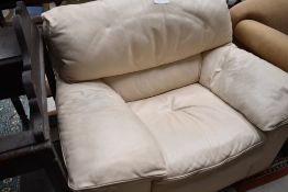 A cream leather easy chair