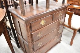 A reproduction oak chest of 2/3 drawers, in the George III style, having a moulded rectangular top