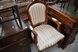A reproduction upholstered carver chair