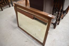 An early 20th Century oak dressing table mirror, now with wall mountings