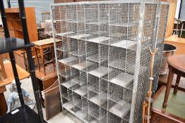 Two vintage galvanised metal shoe storage racks, reportedly from a local school