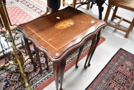 A reproduction next of three tables having inlay decoration on cabriole legs