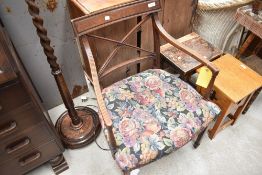 A regency mahogany armchair, with curved tablet top rail over X-form splats and padded bow-fronted