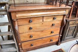 A Victorian mahogany chest of one concealed over two over three drawers, having paw decoration to