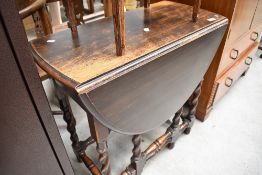 An early 20th Century oak twist and turn gateleg table, compact size, width approx. 72cm