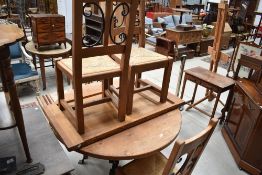 A rustic heavy extending kitchen table and chairs