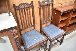 A pair of early 20th Century oak railback dining chairs