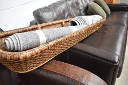 Two polyester rugs and a large basket style planter/storage