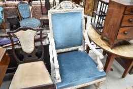 A Continental painted armchair in the French style with blue dralon upholstery