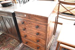A Victorian mahogany Davenport desk having slope top and four drawer base, of plain form