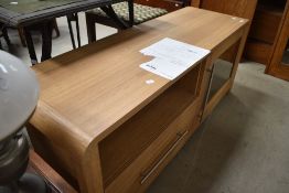 A modern oak effect entertainment unit, cost £190 from Homebase