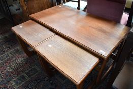 A vintage teak coffee table next of Danish Mobelfabrikken Toften stylised design