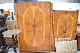 A 1930's/40s walnut two piece bedroom suite, comprising double wardrobe and smaller fitted wardrobe,
