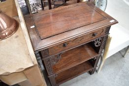 A Chinese hardwood cabinet or bookcase with panelled rectangular top above a single frieze drawer