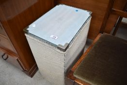 A vintage woven fibre linen basket