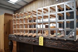 Two modern galvanised metal and pine bottle racks