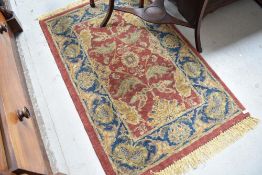 A traditional wool rug, approx 129 x 83cm