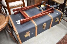 A vintage luggage trunk, and a later luggage stand