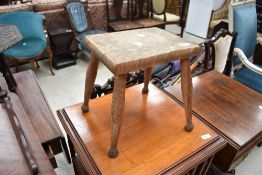 A traditional sycamore topped four legged stool