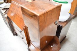 An early 20th Century walnut bedside cabinet