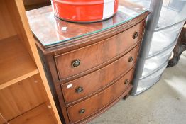A reproduction Regency small chest of three drawers