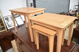 A set of modern golden oak occasional tables