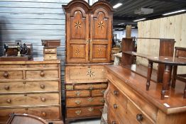 A 19th Century oak and star inlaid bureau bookcase in the Queen Anne/low countries style having