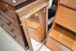 A reproduction gilt frame over mantel or hall mirror
