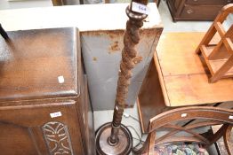 A 1940's oak barley twist standard lamp, with circular base