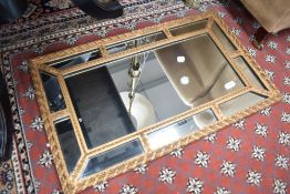 A vintage multi panel gilt frame wall mirror